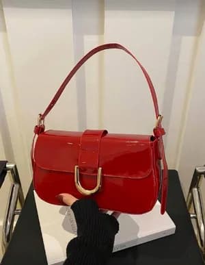 Shoulder sling bag with golden accent