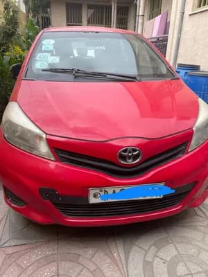 Red Toyota Hatchback for Rent